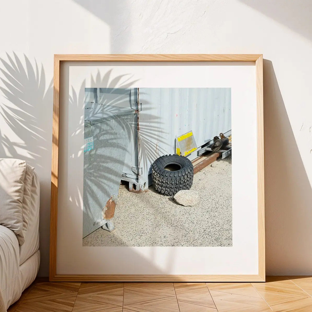 Feeling Tyred, Smiggins street photography print in frame on floor.