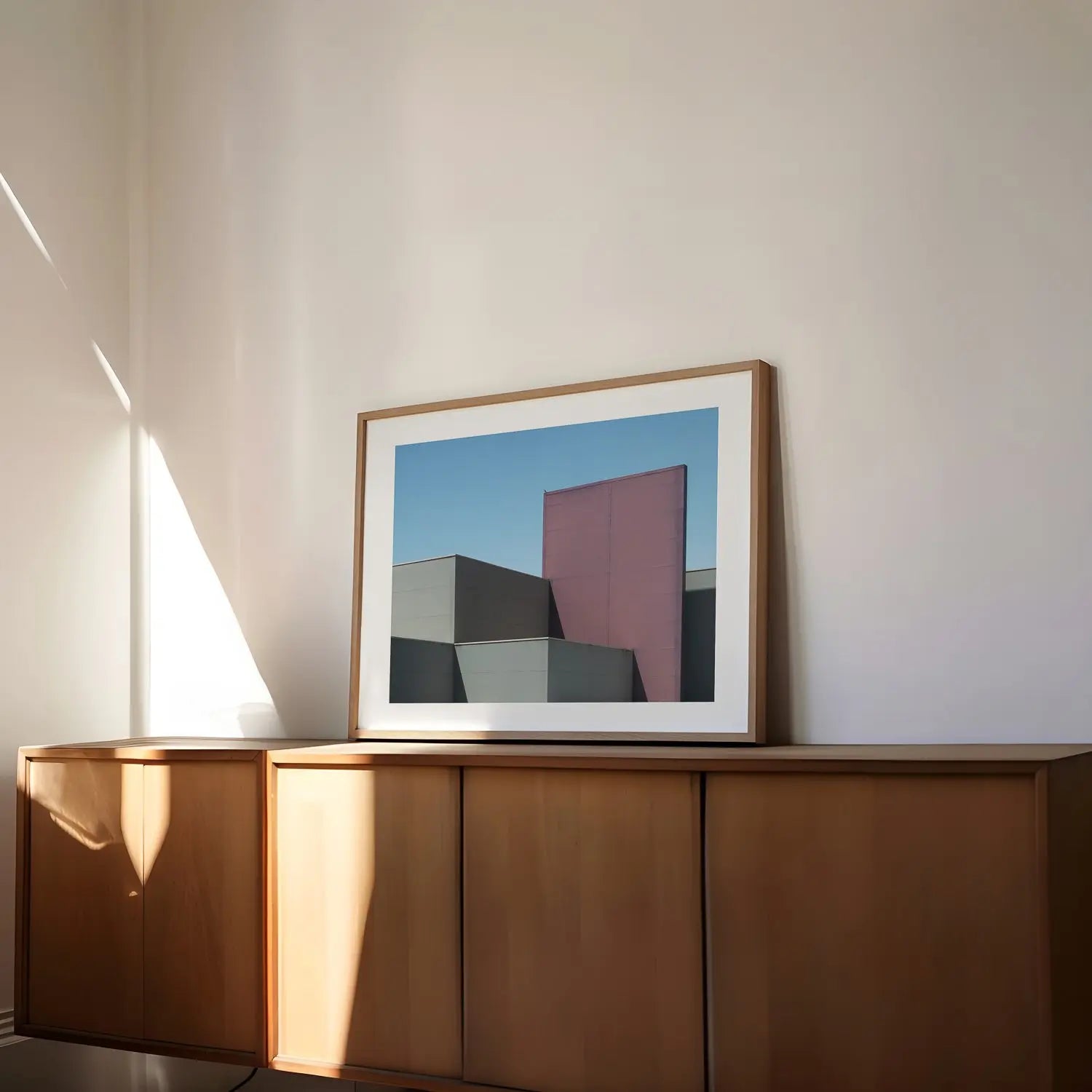 Birds aren't real. Canberra minimalist photography print in frame on table.